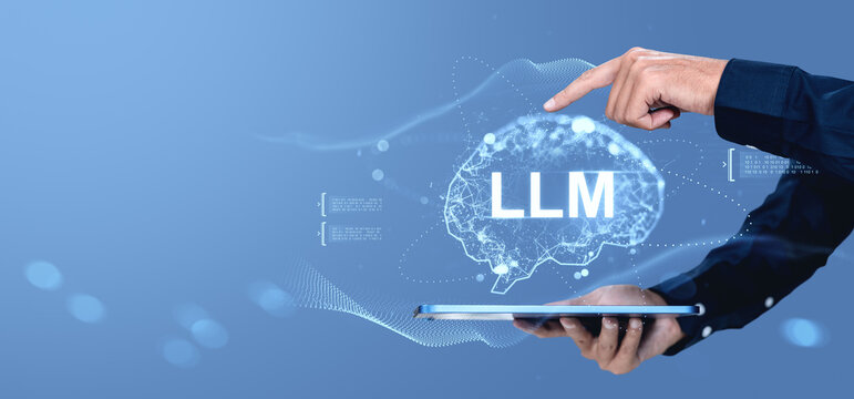 LLM concept with human hand pointing at glowing digital brain projection from tablet on blue tech background, showcasing large language model technology.