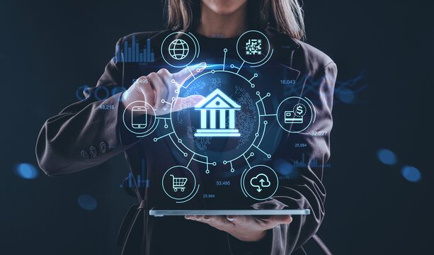 Digital banking concept with hologram interface showing finance icons and technology interaction on futuristic background in innovation context.