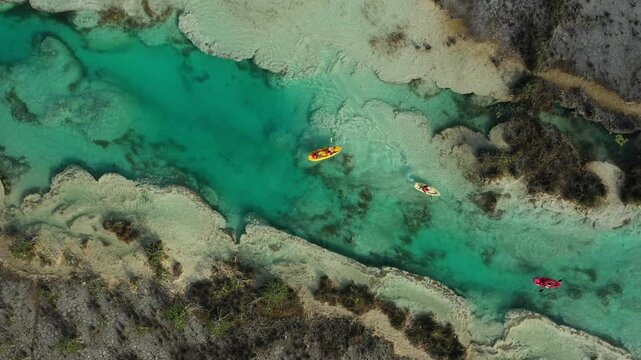 Kayakers navigating the clear waters of a river in Sian Ka'an biosphere reserve, a UNESCO World Heritage Site in Mexico