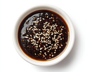 Dark, glossy sauce in small white bowl