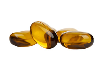 Pile of translucent amber colored softgel capsules with light reflecting on their smooth surfaces