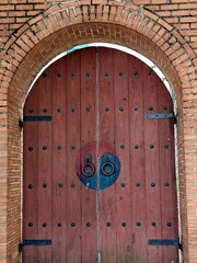 Traditional Korean wooden door decorated with Taegeuk patterns - Taegeuk symbol is typically associated with Korean traditions and represents balance in the universe