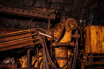 Old drilling jumbo in underground mine