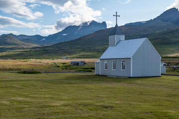 Bakkagerdi Church in Bakkagerdi town and sea in Iceland