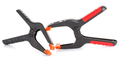Obraz premium Two black plastic clamps with red handles