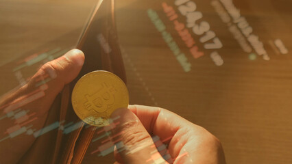person holding Bitcoin coin near wallet with financial chart overlays, symbolizing digital investment and cryptocurrency economy