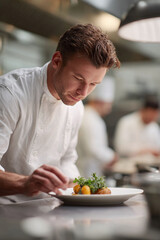 Fototapeta premium A chef meticulously plates a gourmet dish in a professional kitchen. Food preparation, culinary arts, fine dining concept. Ideal for restaurant marketing, cooking blogs.