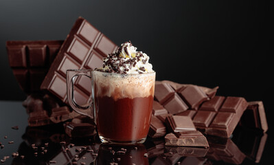 Hot chocolate with whipped cream and sprinkled with chocolate crumb.