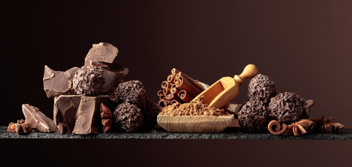 Chocolate truffles with broken pieces of chocolate.