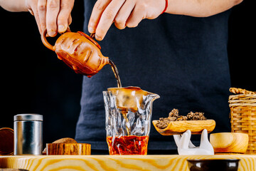 Chinese Pu-erh tea on a wooden stand. Tea ceremony