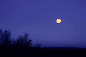 Full Moon, stars, planets and landscape scenery silhouettes.