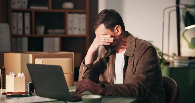 Backlog, headache and laptop with man in logistics office for delivery, distribution or shipping delay. Computer, stress and typing with employee in workplace for supply chain fail or mistake