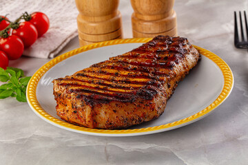 Grilled pork steak with bone