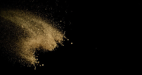 Fine beige cosmetic powder cloud suspended in air, isolated on black background. Elegant abstract motion concept captured in studio light. Makeup explosion and beauty design.
