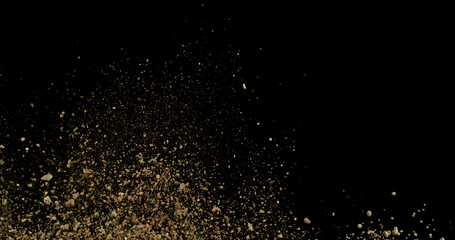Detailed wave of airborne clay dust swirling in chaotic motion, captured in freeze  motion. Dramatic natural explosion of earthy particles on black background.