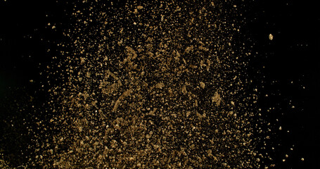 Detailed wave of airborne clay dust swirling in chaotic motion, captured in freeze  motion. Dramatic natural explosion of earthy particles on black background.