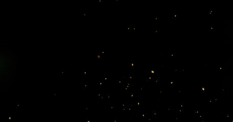 Detailed wave of airborne clay dust swirling in chaotic motion, captured in freeze  motion. Dramatic natural explosion of earthy particles on black background.