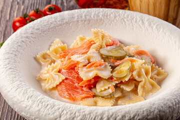 Italian pasta farfalle with salmon