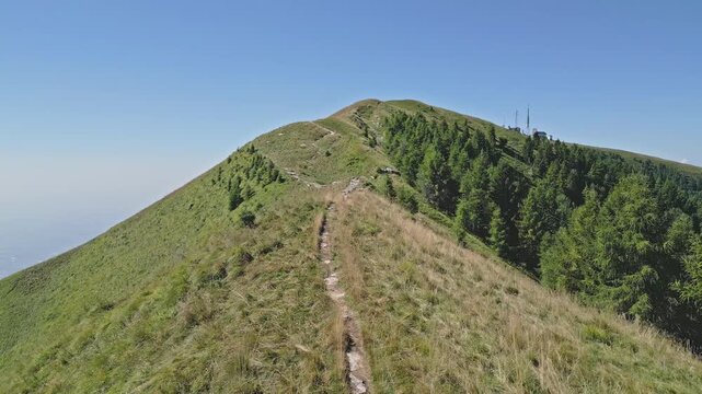 mountain ridge trail under clear blue sky