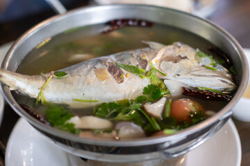 Mackerel tom yum, a spicy and sour Thai soup featuring mackerel, herbs, and aromatic spices.
