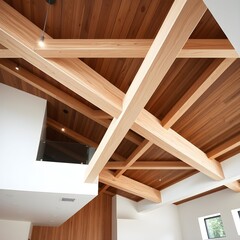 Interior view showcasing a modern ceiling design with exposed wooden beams and natural lighting.
