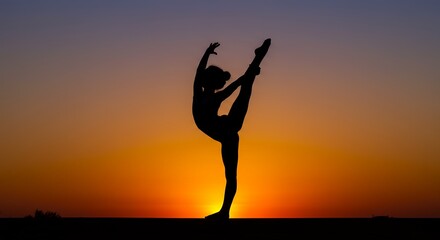 Silhouette of a person doing gymnastics against a sunset sky performing a split leap