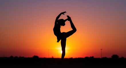 Silhouette of a person practicing yoga at sunset