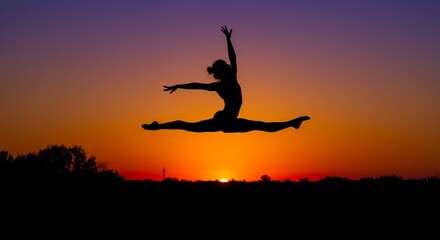 Silhouette of jumping figure against dramatic sunset sky