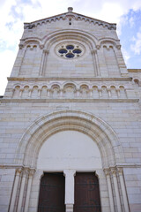Front view of old church building with arched entrance