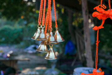 Small bells hanging in street market shop 
