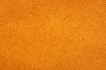 Suede. Background of yellow. The texture of the skin is natural.