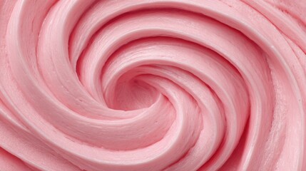 A swirl of pink frosting on a cake. The frosting is thick and creamy, and the swirls are tight and defined. The pink color gives the frosting a sweet and inviting appearance, perfect for a dessert