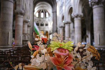 Colorful flower arrangement in historic church hall