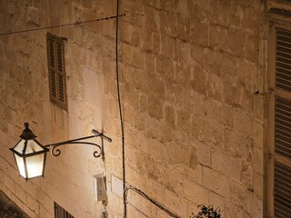 Old streel lamp and window Valletta Malta