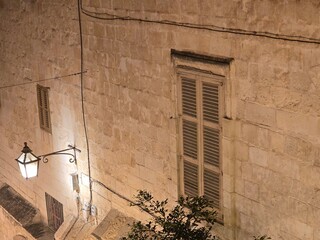 Old streel lamp and window Valletta Malta