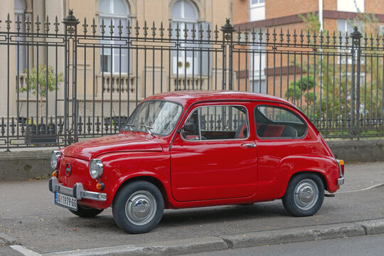 Classic Car Red Zastava 750 Yugoslav Production Fiat Supermini Parked at Street in Belgrade Serbia