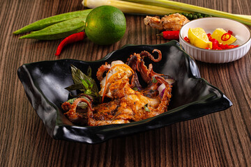Gourmet grilled whole octopus served lime