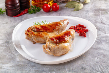 Roasted rabbit leg served rosemary