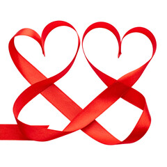 Two intertwined red ribbon hearts on a black background. Close up shot of the hearts