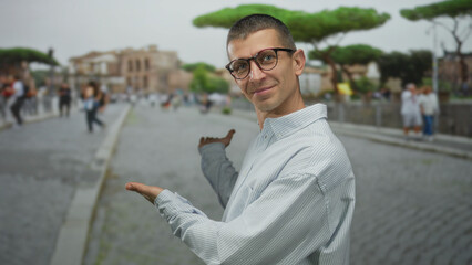 Man in glasses gestures at famous italian street with people, showcasing vibrant urban life on a...