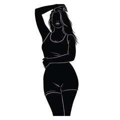 Silhouette of a woman in black tank top and shorts posing with hand in hair and arms crossed