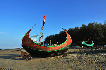The Moon Boat is a rare boat from Cox's Bazar, designed to cross sandy barriers with its curved keel, and is a typical Bay of Bengal boat.