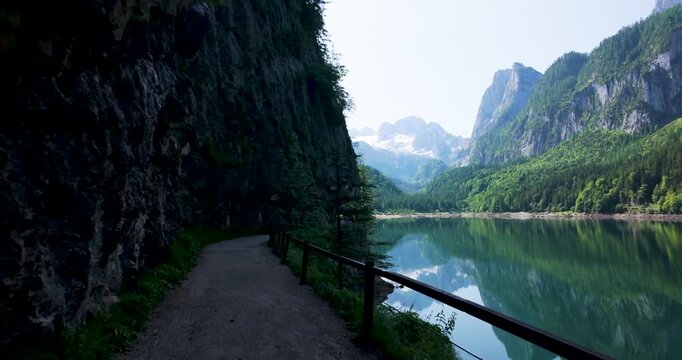 Scenic Path Along Gosausee Lake with Dachstein Mountains and Rock Overhang