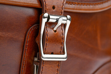 Close-up of buckle of a brown retro leather    