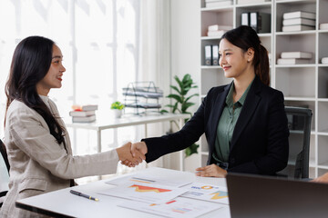 Business handshake for teamwork of business merger and acquisition,successful negotiate,hand shake,two businessman shake hand with partner to celebration partnership and business deal concept

