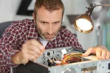 computer repairman on wheelchair working
