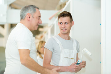 Obraz premium portrait of workman with colleague