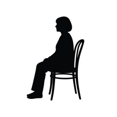 Fototapeta premium Silhouette of a woman with short hair sitting on a chair facing the left side of the frame
