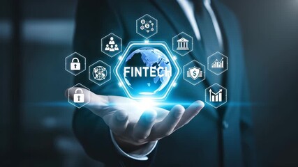 Fintech concept with glowing globe and icons held by a businessman - Powered by Adobe