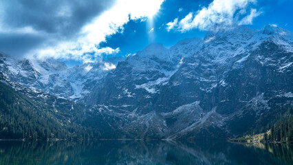 Dramatic Winter Sun Over Sea Eye (Morskie Oko) and Snowy Tatra Peaks, Poland